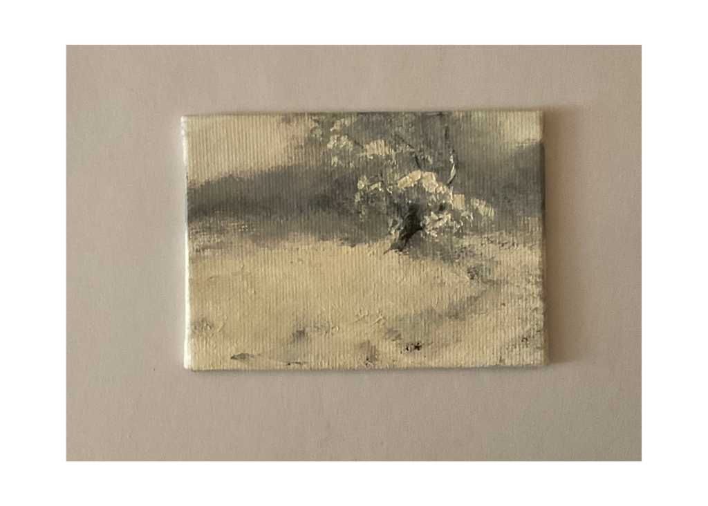 Miniature oil painting of a tree surrounded by snow.